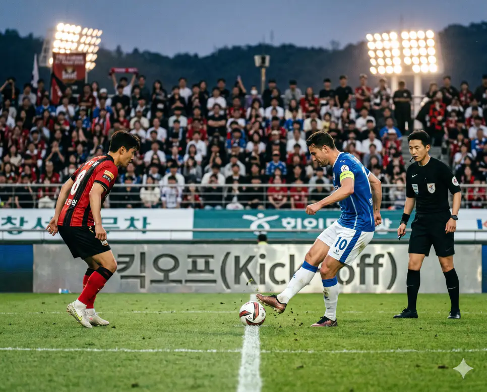 오프사이드 뜻, 세트피스 뜻, 킥오프 뜻: 축구 규칙 위반 정황과 정밀 전술 및 행정 명령의 본질 3 전 후반전의 시작이나 실점 직후에 경기장 중앙의 센터 서클에서 공을 처음 차며 매치의 본격적인 서막을 여는 행정 명령권의 작동 순간인 킥오프(Kick-off)의 서막 순간을 축구 시즌의 뜨거운 열기가 가득한 경기장 중앙 센터 서클에서 주심의 호각 소리와 함께 팀 주장 선수가 정면을 향해 발을 뻗어 공을 차는 날것 그대로의 치열한 실제 스포츠 시작 구도로 고증한 정면 극실사 이미지